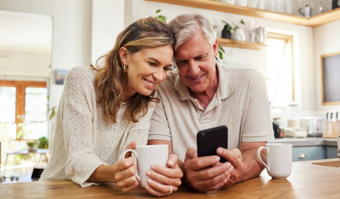 Senior couple on smartphone reading online social media post, search holiday house website or retir