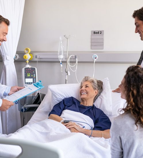 Doctor visiting senior patient with family